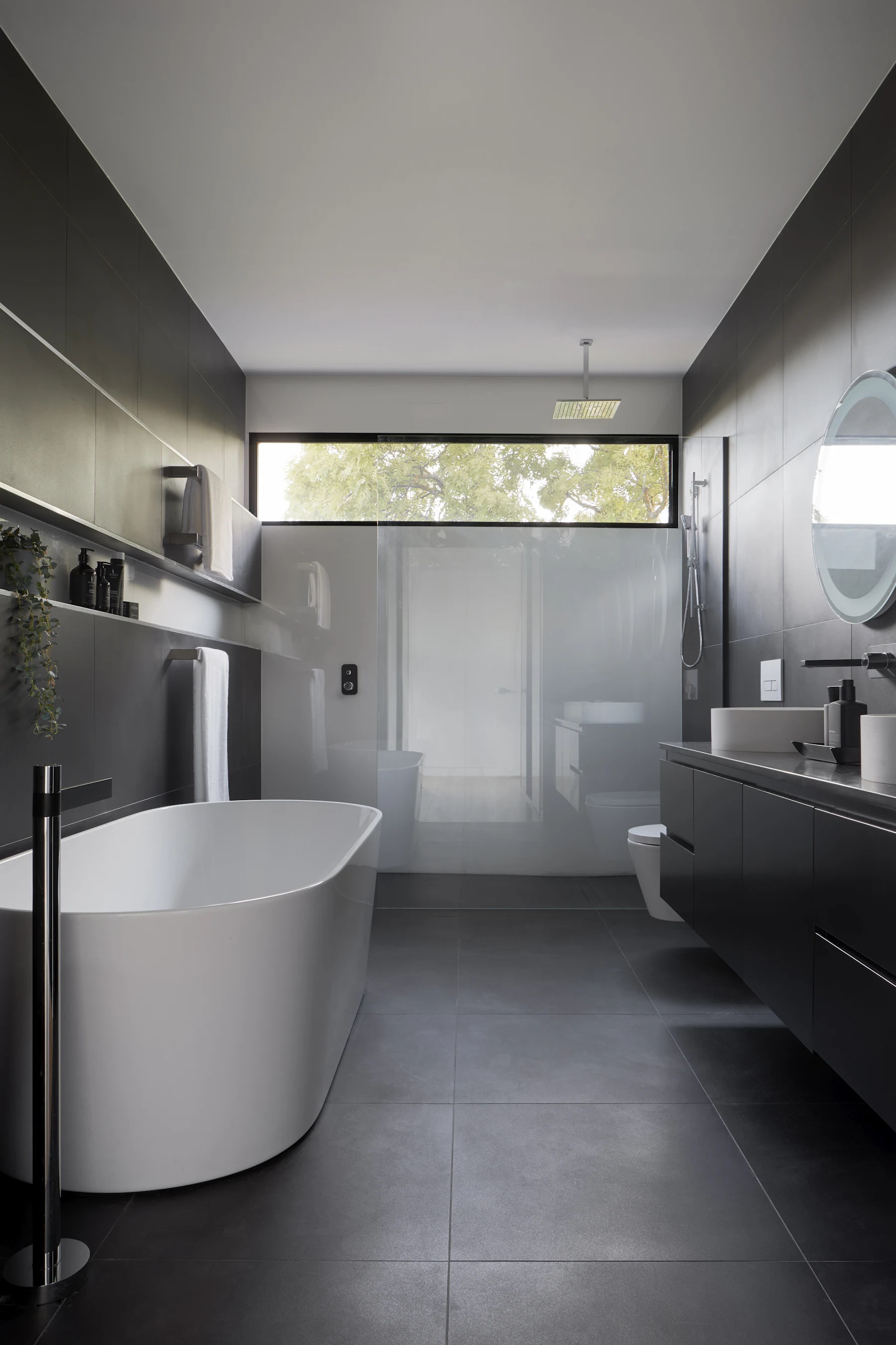 Freestanding bath in a stone bathroom