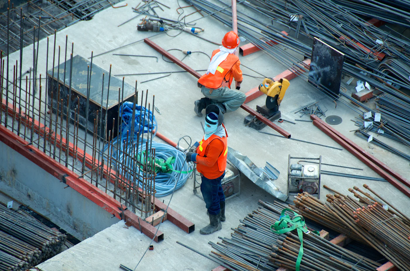 Construction crew fixing steel reinforcement