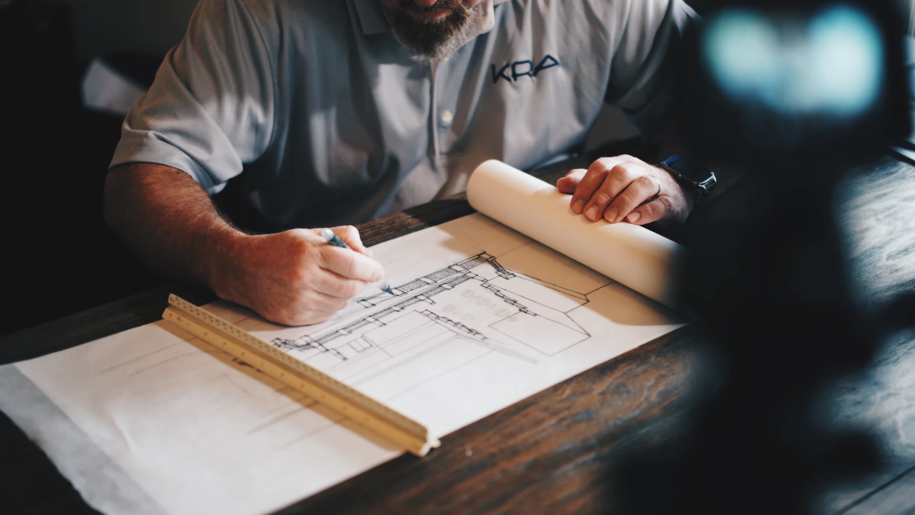 Architect marking up plan drawings