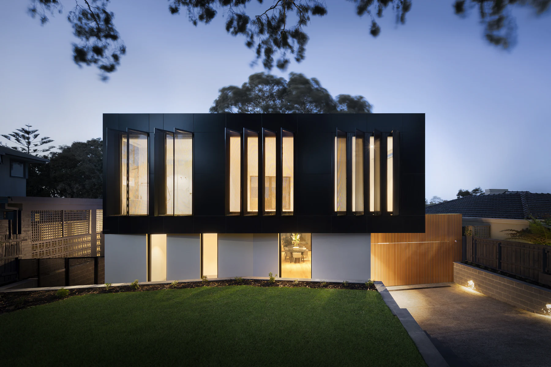 Garden elevation of a Vellbrook house at dusk